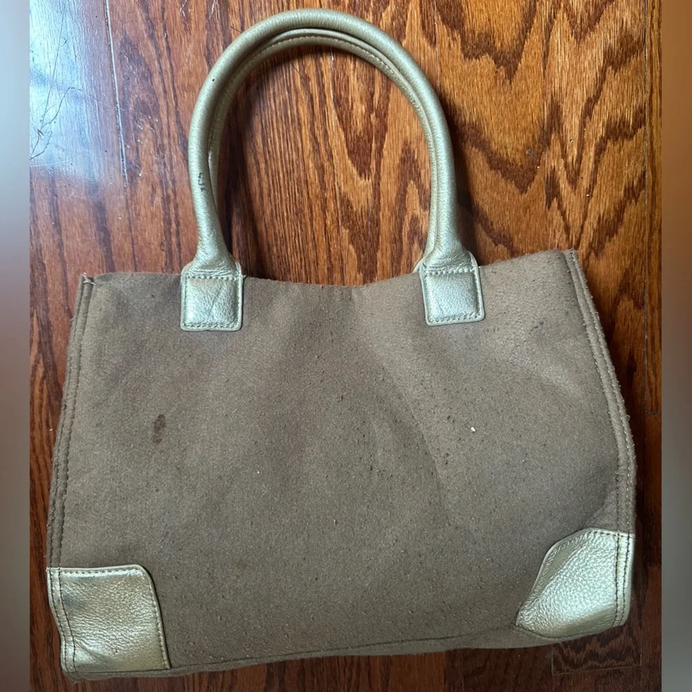 Tory Burch Ella tote features a wool canvas body with gold leather trim & handle
